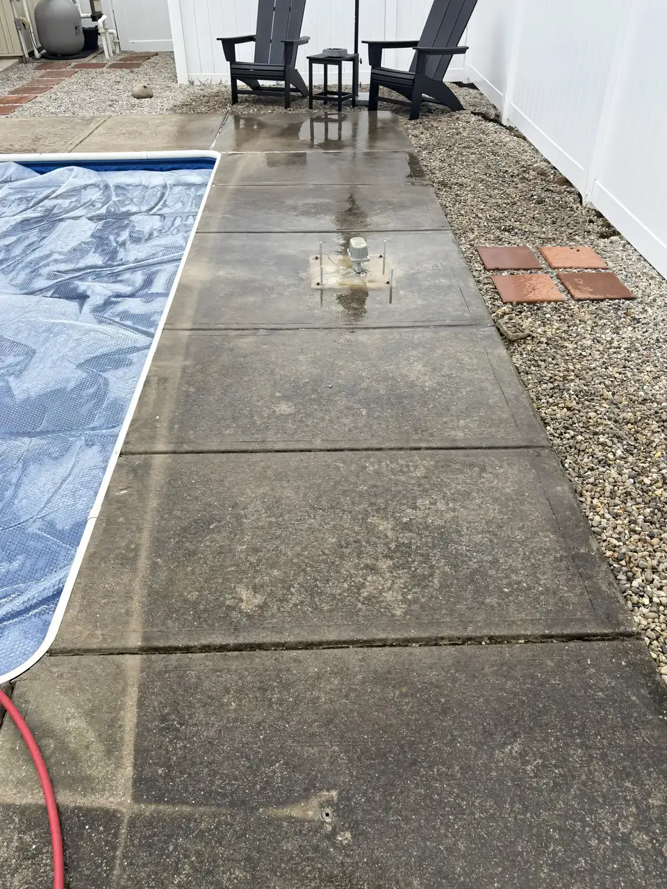 Concrete patio surface before cleaning — stained, dirty, discolored